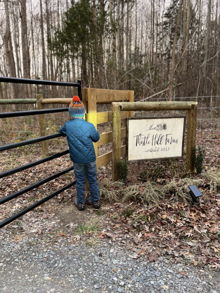 boy-reading-farm-sign